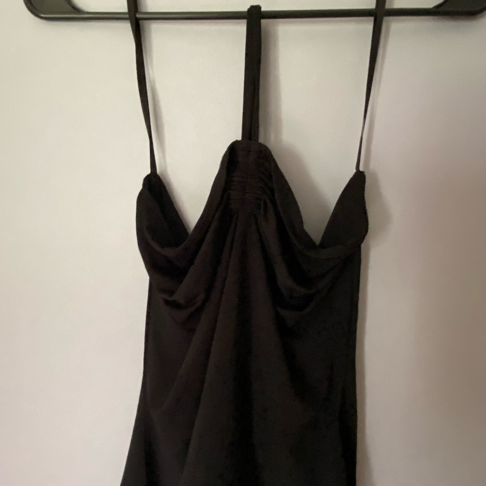 Black going out top